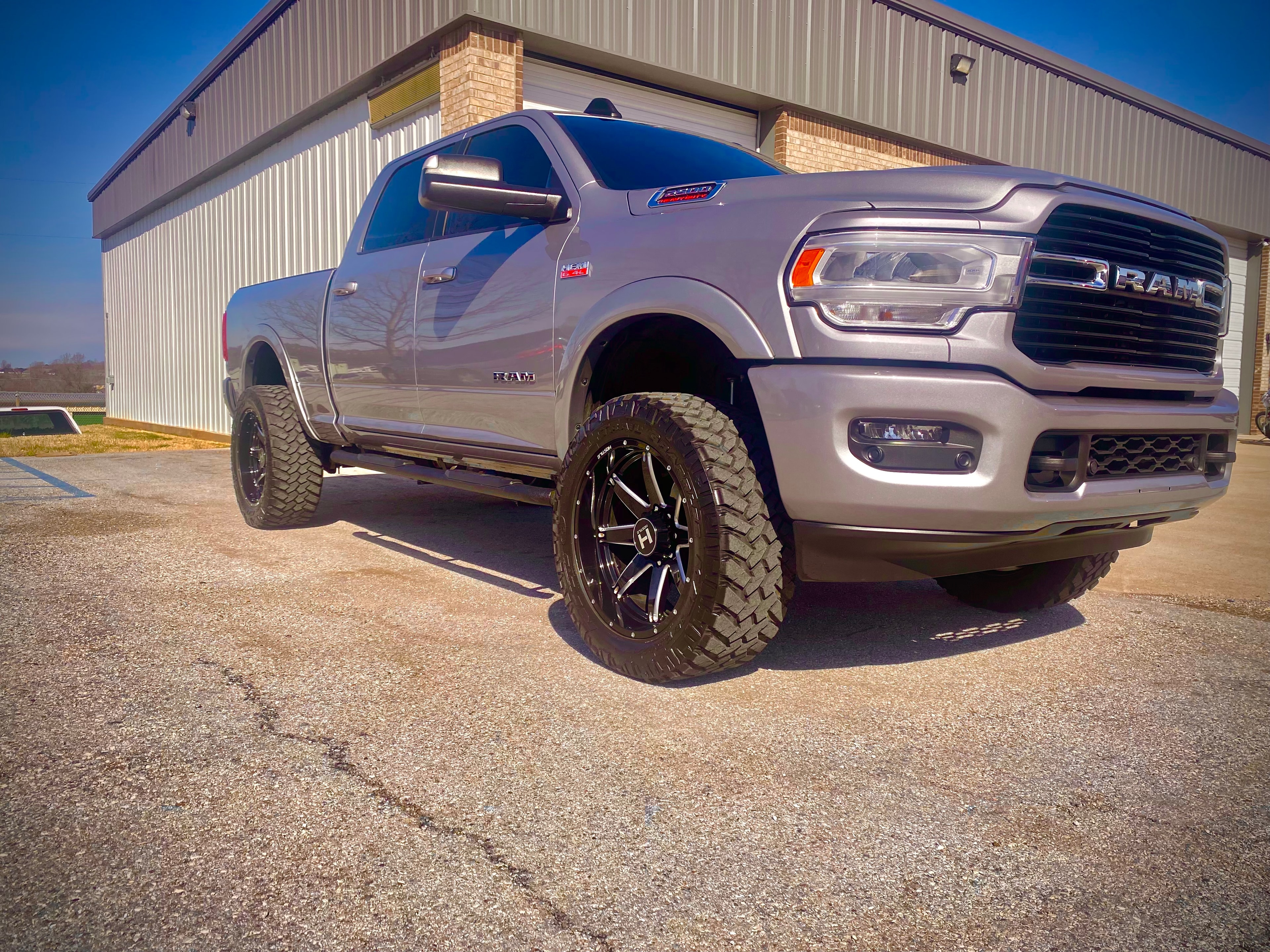 Lifted silver Ram 2500 with custom wheels