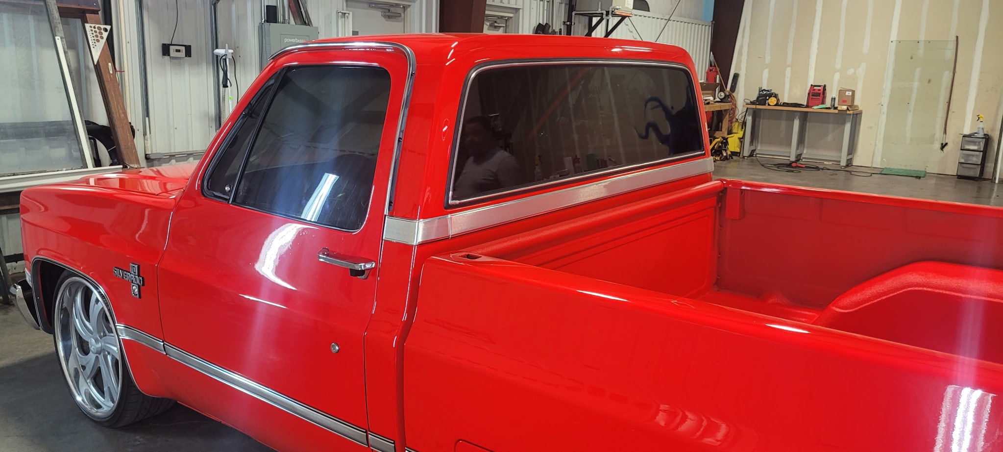 Red pickup truck in garage