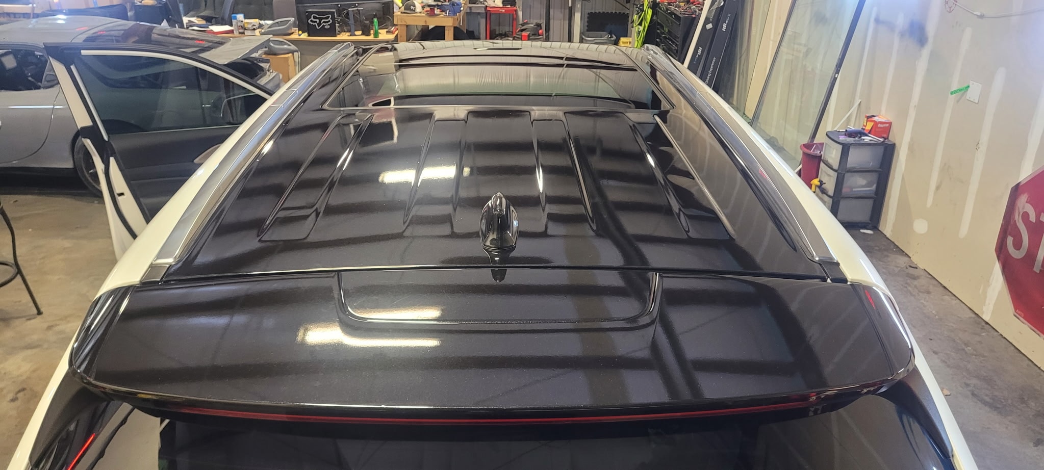 Truck bed tonneau cover in garage