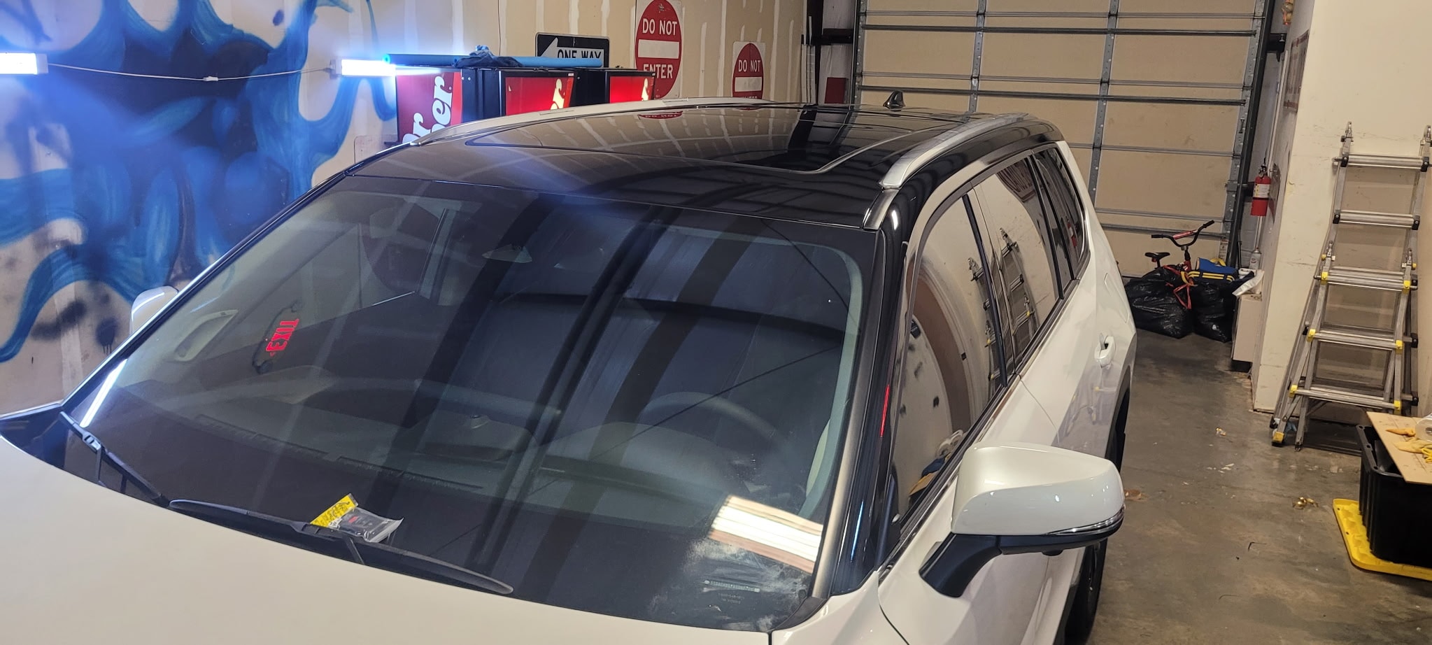 White SUV parked in garage
